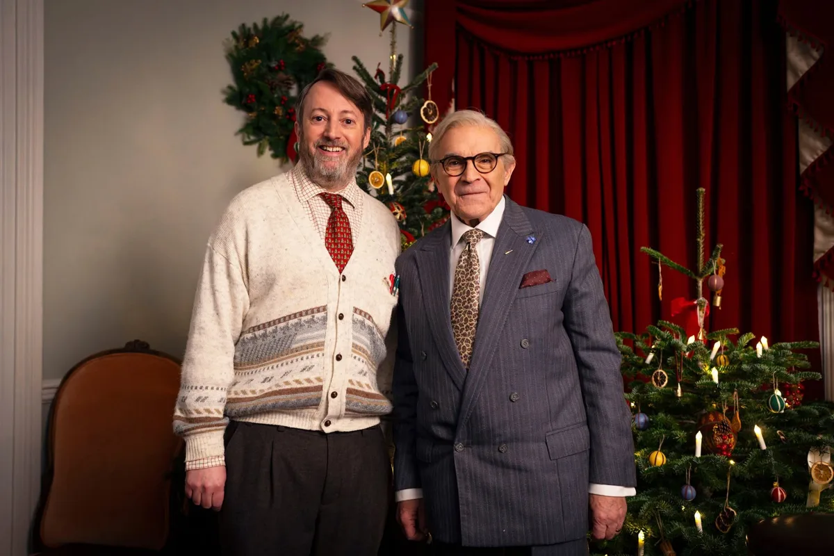 David Mitchell and Sir David Suchet in front of a Christmas tree for the Ludwig Christmas Special