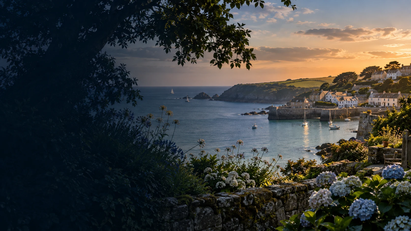 A sunset view over a Cornish coastal village harbour