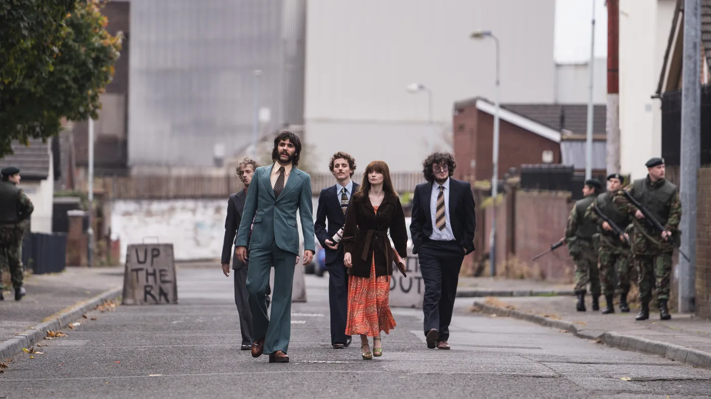 Cushla and friends walk a Belfast street past British soldiers in Trespasses